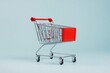 © Naru - A small shopping cart on a light blue background symbolizing online shopping, consumerism, retail, e-commerce, and purchasing.