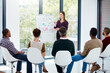 © ThurstanJam/peopleimages.com - Woman, board and presentation in boardroom with team, discussion or planning with graphs at startup. Speaker, business people and feedback with stats, charts or review with finance at creative agency
