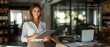 © ZMPixels - Latin mature adult professional business woman looking at online trade app. European businesswoman CEO holding digital tablet using tab application standing at workplace in office. Banner, copy space