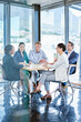 © C.Arcurs/peopleimages.com - Team, meeting and paper in office for business, marketing strategy and finance management. Corporate people, woman speaker and discussion at table with report, feedback or planning for upcoming audit