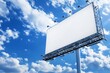 © pham - A blank billboard stands tall in an urban area under a bright blue sky dotted with fluffy clouds, waiting for an advertisement