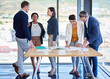 © C.Arcurs/peopleimages.com - Documents, meeting and strategy with business people in boardroom of office for conversation together. Architecture, collaboration and meeting with professional employee group talking in workplace