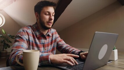 Freelancer programmer working from home using laptop, typing text on keyboard, creating innovative program, close up