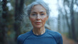 © Vertigo Images - A woman with gray hair looks intently at the camera.