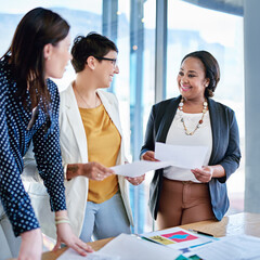 Poster - Group, paperwork and smile in office, talking and analysis of report, meeting and review. Corporate, explaining and women with media coordinator, documents and terms of campaign, reading and project