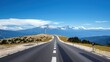 © miss irine - Narrow highway leads to iconic Mont Ventoux mountain in France. Blue sky with clouds in background. Scenic road winds up to summit. Provence landscape with rocky terrain.