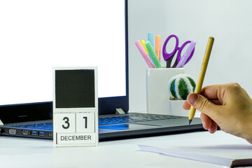 Woman work in office on notebook at 31 december before new year