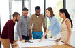 © peopleimages.com - Architecture, business people or meeting with blueprint in office for planning home remodeling project. Collaboration, architect team or pointing to floor plan for building design, draft or diversity
