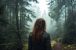 © atar - Woman walking alone through misty forest, back view.  Nature, solitude, travel, adventure, wanderlust, exploration, freedom.
