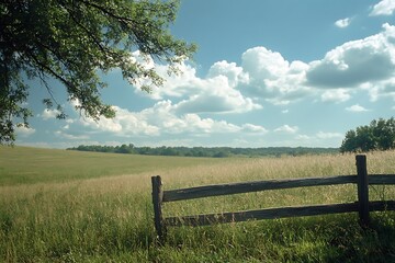 Poster - Green Field and Wooden Fence under Sunny Sky with White Fluffy Clouds