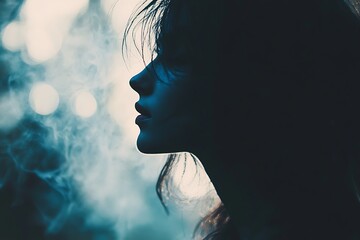 Sticker - Silhouette of a woman's face against a blue and white bokeh background