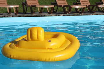 Poster - Yellow float in swimming pool at luxury resort