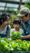 © Akharadat - Several Asian farmers working together in a hydroponics system on a vegetable farm. In a greenhouse garden, grandparents teach their grandchildren how to grow and care for organic lettuce vegetables.