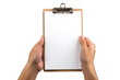© wikanda - A hand holding a small clipboard with paper, ready for writing or checking off a list