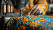 © Komkrit - A tailor working on a sewing machine, fabric flowing through their hands as they stitch with precision, surrounded by neatly arranged spools of thread and patterns
