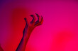 © NanSan - A terrifying witch's hand with long red nails, resembling a demon or vampire. Its gnarled appearance hints at monstrous origins, resembling an alien or ghostly entity,with zombie-like decayed skin.