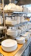 © PLE.POD - Clean and organized white dishes on a shelf.
