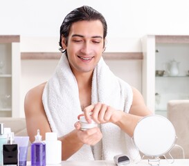 Wall Mural - Young handsome man in the bathroom