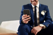 © Malambo/peopleimages.com - Groom, hand and man with phone reading wedding vows for marriage ceremony with happiness for love. Technology, app and person with cellphone for commitment or romantic celebration speech at hotel.