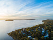 © Austockphoto - Aerial view of Pulbah Island in blue still water of Lake Macquarie on calm evening