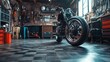 © K silver - A motorcycle is parked in a garage with a lot of tools and equipment