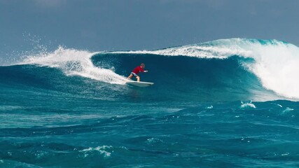 Poster - Experienced surfer rides the ocean wave at the famous Sultans surf spot on the North Atolls in the Maldives