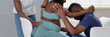 © Andrey Popov - Black American Doula Providing Birth Care