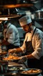 © Kind Bee Studio - Chef preparing food in a restaurant kitchen.