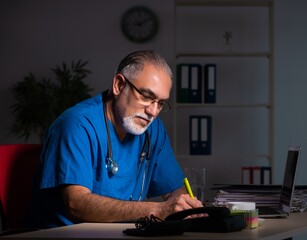 Sticker - Aged male doctor in the hospital at night