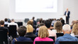 © leszekglasner - Rear view of the audience at a business conference meeting event listening to the speakers speech