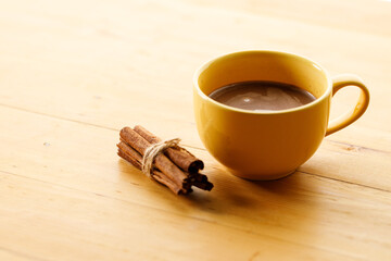 Cup of delicious hot chocolate on wooden table background. Copy space. Selective focus.