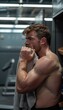 © spyrakot - Man in Modern Gym Locker Room with Movember Mustache Drying Face After Workout