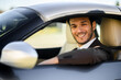 © Minerva Studio - Smiling businessman in luxury car