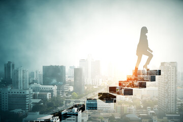 Silhouette of a woman walking up steps over a city skyline at sunrise, symbolizing career growth and ambition.