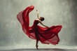 © Fotograf - A woman dressed in a red dress is dancing