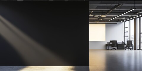 A contemporary office features black and white walls, large windows allowing sunlight, and minimalist furniture arranged for work