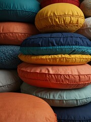 Canvas Print - Colorful stack of round cushions in different shades.