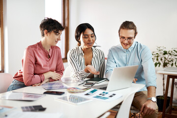 Poster - Creative, teamwork or designers on laptop in startup for planning, project review or meeting feedback. Color choice, group or people in agency for networking online, social network update or news