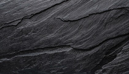 Black or dark gray rough grainy stone texture background