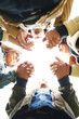 © JordaanExams/peopleimages.com - Support, circle and people holding hands together for prayer, solidarity or trust from below. Team building, connection and group of friends in huddle for worship, gratitude and care for community