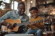 © Preeti - Its a father-son collaboration. Shot of a happy father accompanying his young son on the guitar while he drums on a set of cooking pots, Generative AI