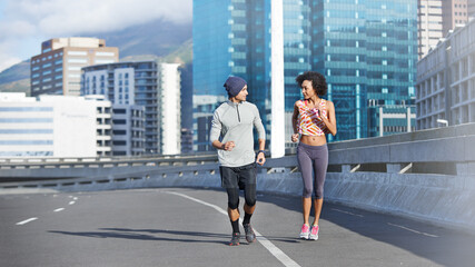 Poster - Couple, talking and running in city for fitness, health and bonding together in morning with sport. People, chat and active for love, exercise and workout on bridge with teamwork training in urban