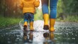 © Артур Комис - a woman with a child in rubber boots on the water. Selective focus