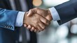 © peerawat - A businessman shaking hands with a client after a successful negotiation, highlighting professionalism