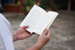 © Sanhanat - Close up man is reading book. Concept, self study, reading book for knowledge, pleasure or self development to apply knowledge in daily life living. Read for preparing exam.