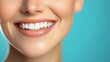 © Anastasiia - Close-up of a perfect smile with white teeth on a turquoise background – ideal for dental care and beauty advertising