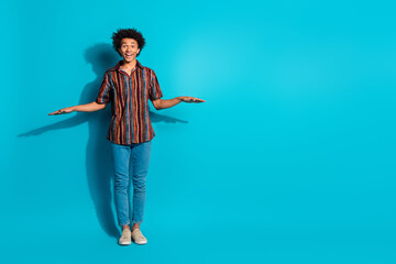 Sticker - Full body portrait of nice young man measure empty space wear shirt isolated on turquoise color background