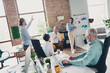 © deagreez - Full body photo of teamwork people working together brainstorming conference comfortable modern office loft room interior indoors workspace