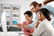 © Malambo/peopleimages.com - Business, people and happy with pointing on computer at office for deadline or task competition. Employees, coworking and meeting with smile for teaching, learning and advice with software update