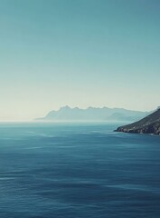 Wall Mural - Mountain Range in Distance Over Ocean Water